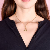 10K Gold Hockey Sticks and Puck Pendant