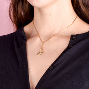 10K Gold Hockey Sticks and Puck Pendant