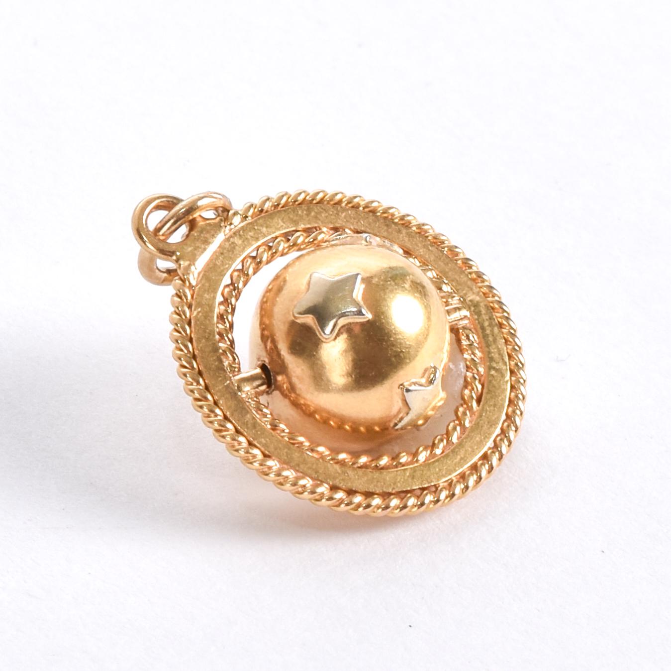 18K Rotating Globe Pedant with White Gold Stars