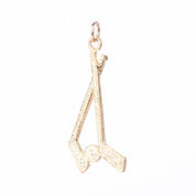 10K Gold Hockey Sticks and Puck Pendant
