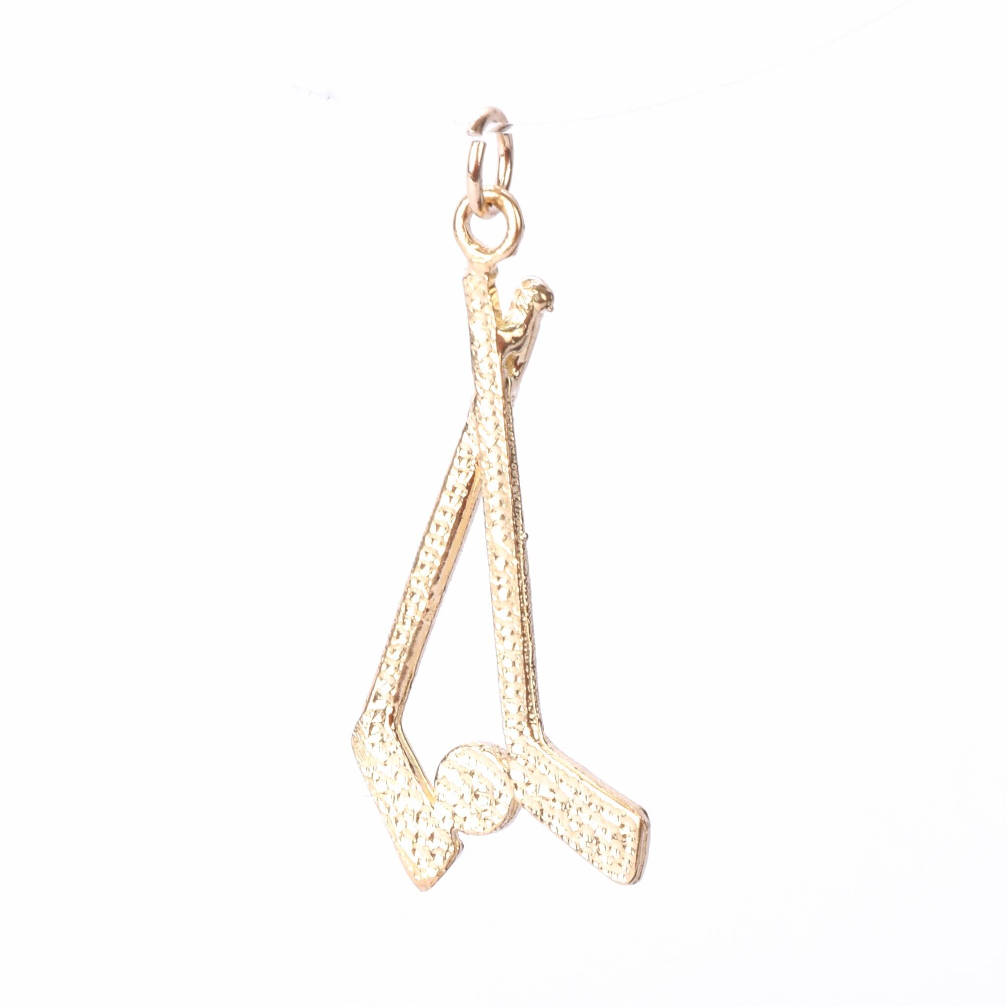 10K Gold Hockey Sticks and Puck Pendant