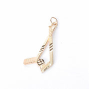 10K Gold Hockey Sticks and Puck Pendant