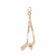 10K Gold Hockey Sticks and Puck Pendant