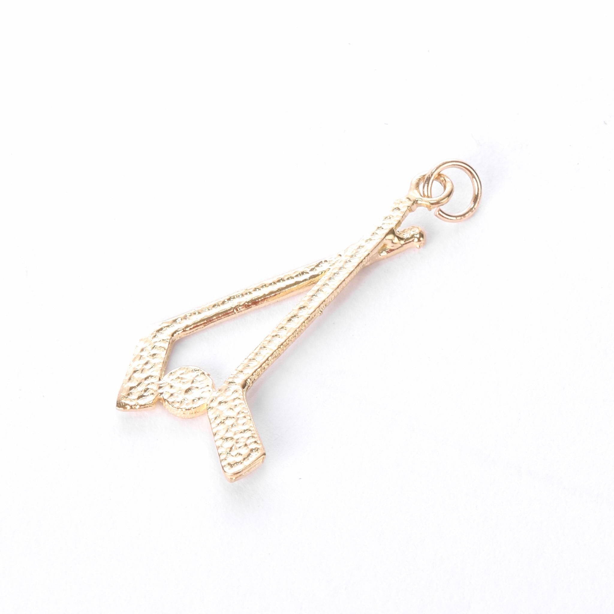 10K Gold Hockey Sticks and Puck Pendant