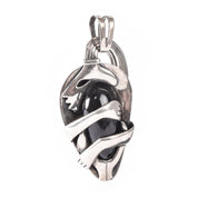 Sterling Silver Mexican Diety Hugging an Onyx Pendant