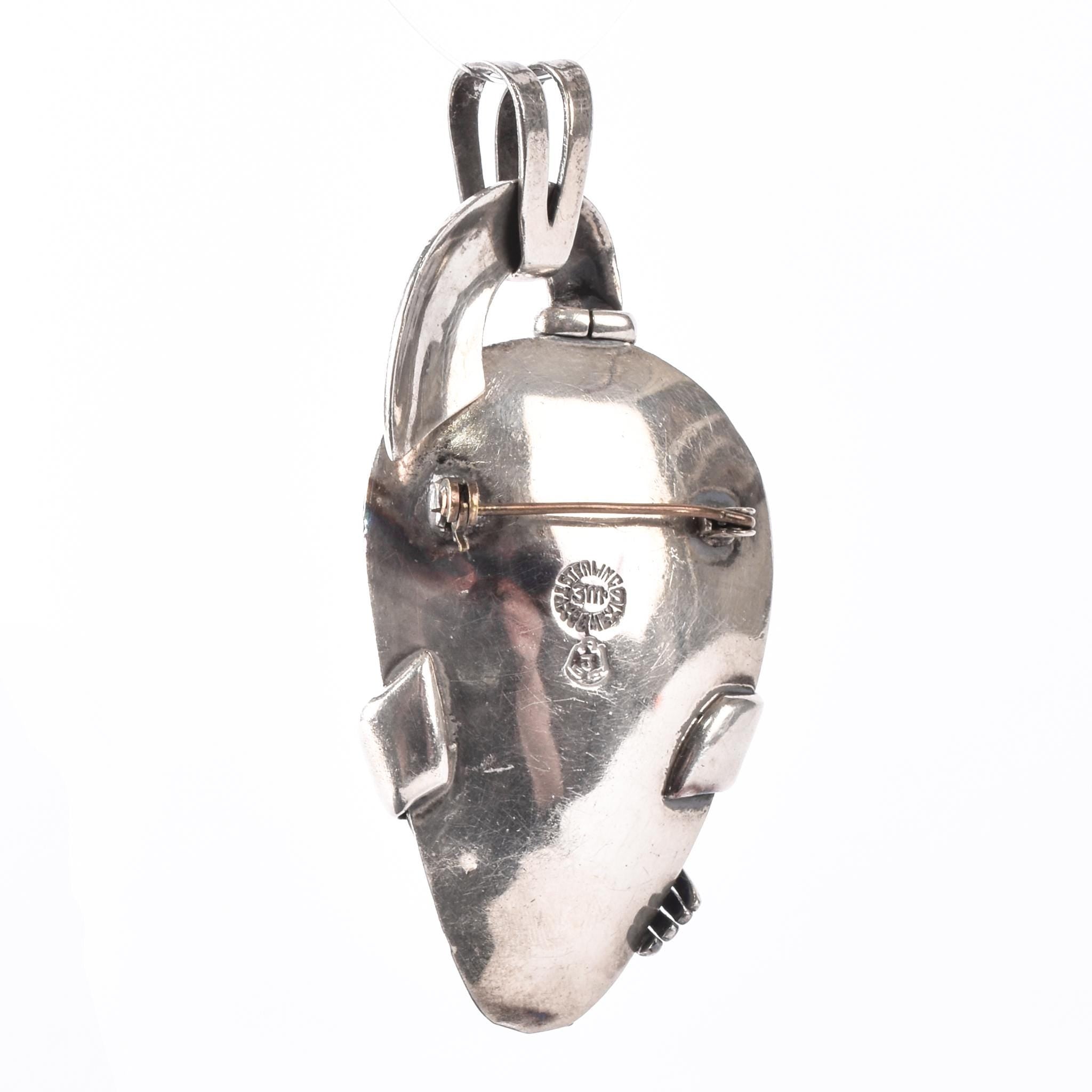 Sterling Silver Mexican Diety Hugging an Onyx Pendant
