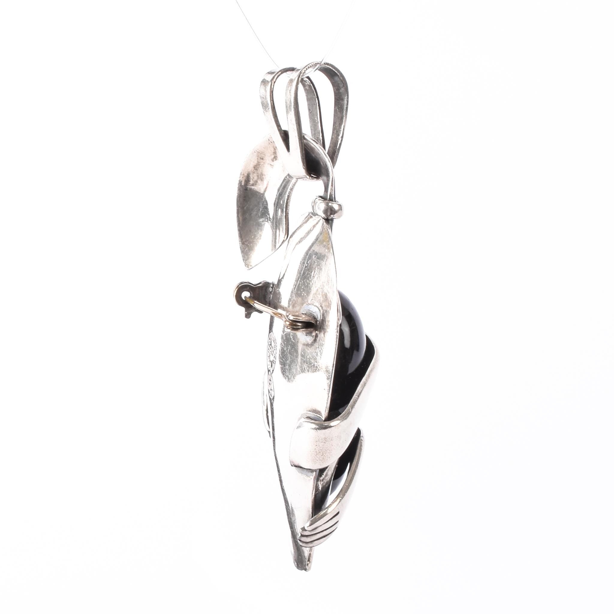 Sterling Silver Mexican Diety Hugging an Onyx Pendant