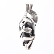 Sterling Silver Mexican Diety Hugging an Onyx Pendant