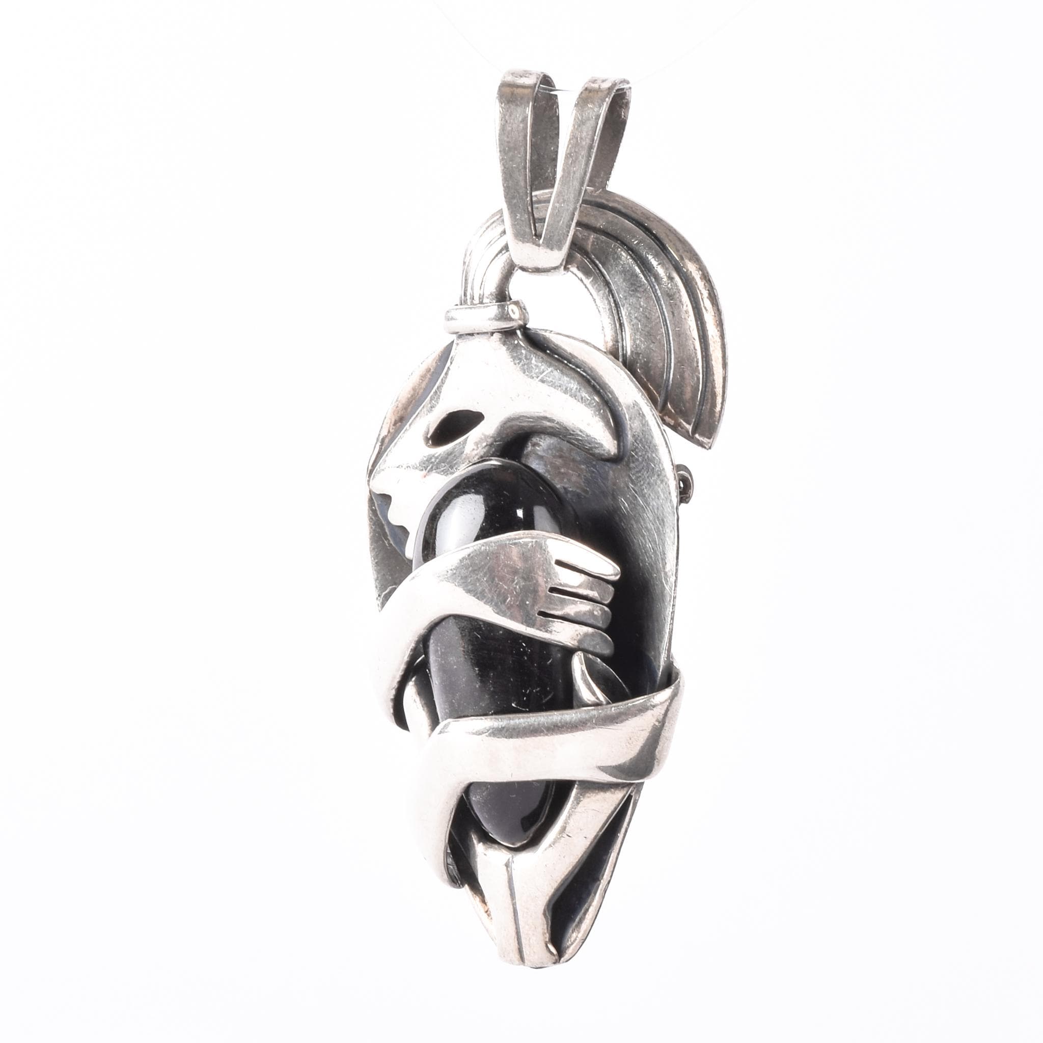 Sterling Silver Mexican Diety Hugging an Onyx Pendant