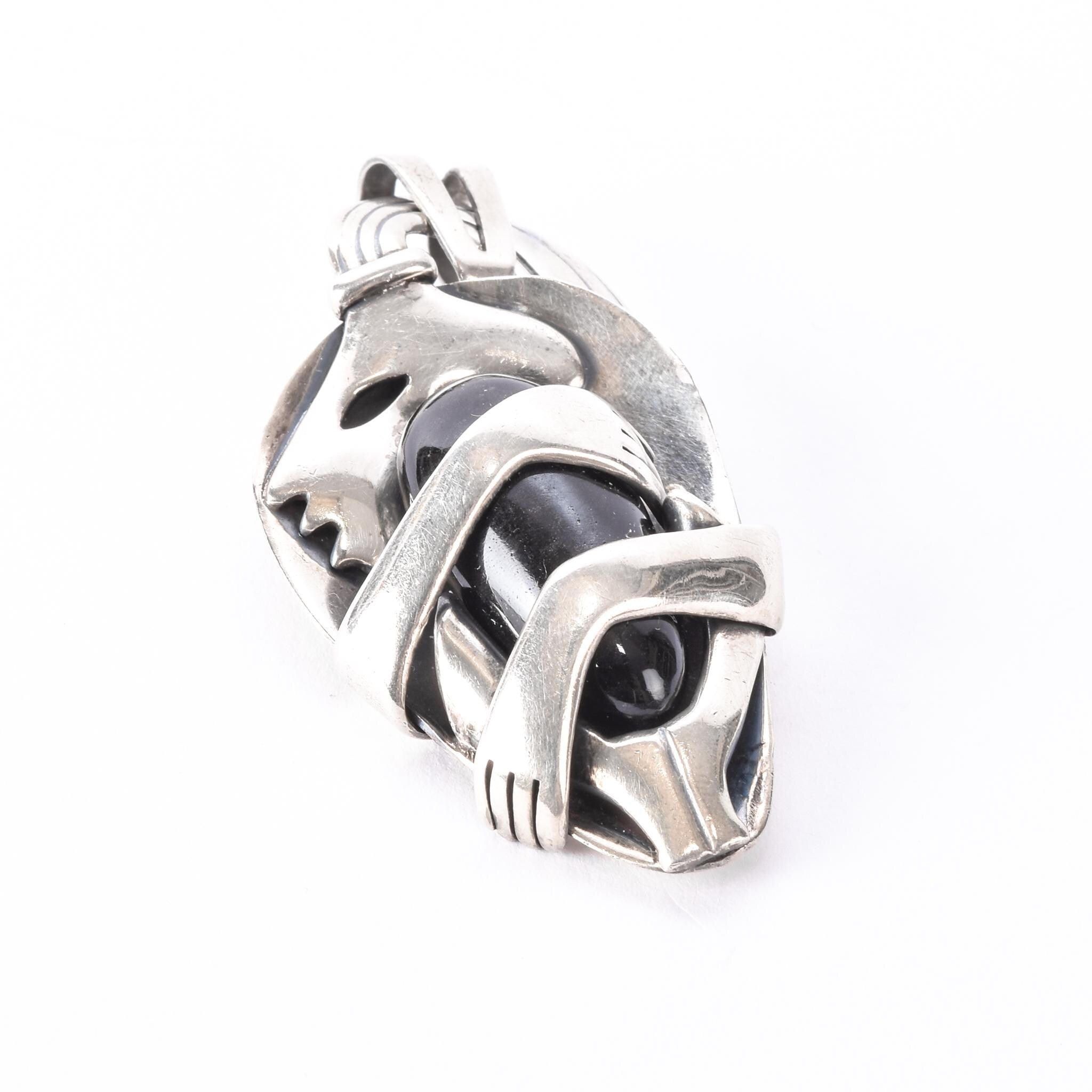 Sterling Silver Mexican Diety Hugging an Onyx Pendant