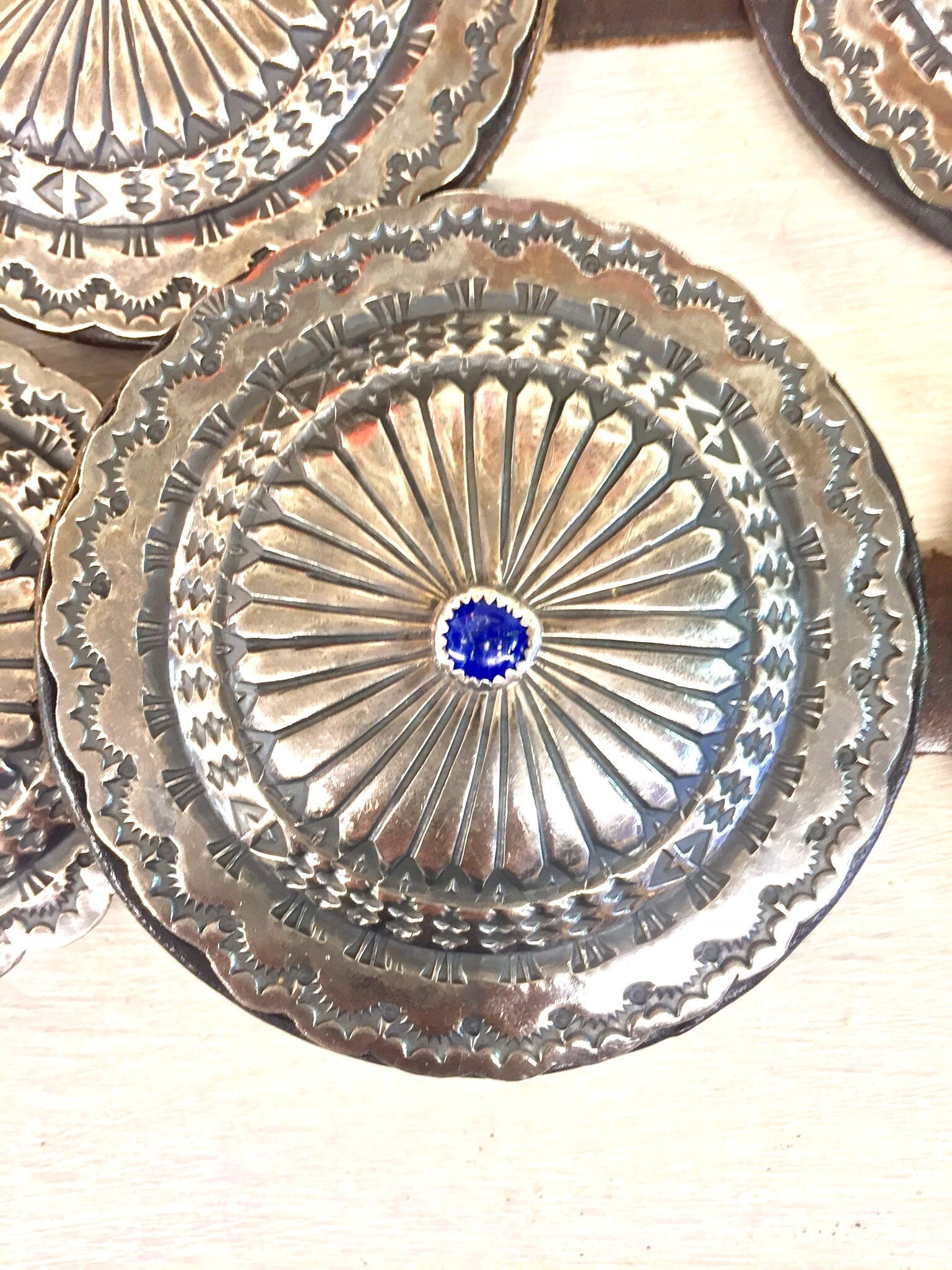 Vintage Navajo sterling silver concho belt with lapis lazuli stone accents, handmade Native American leather belt showcasing intricate southwestern designs and craftsmanship.
