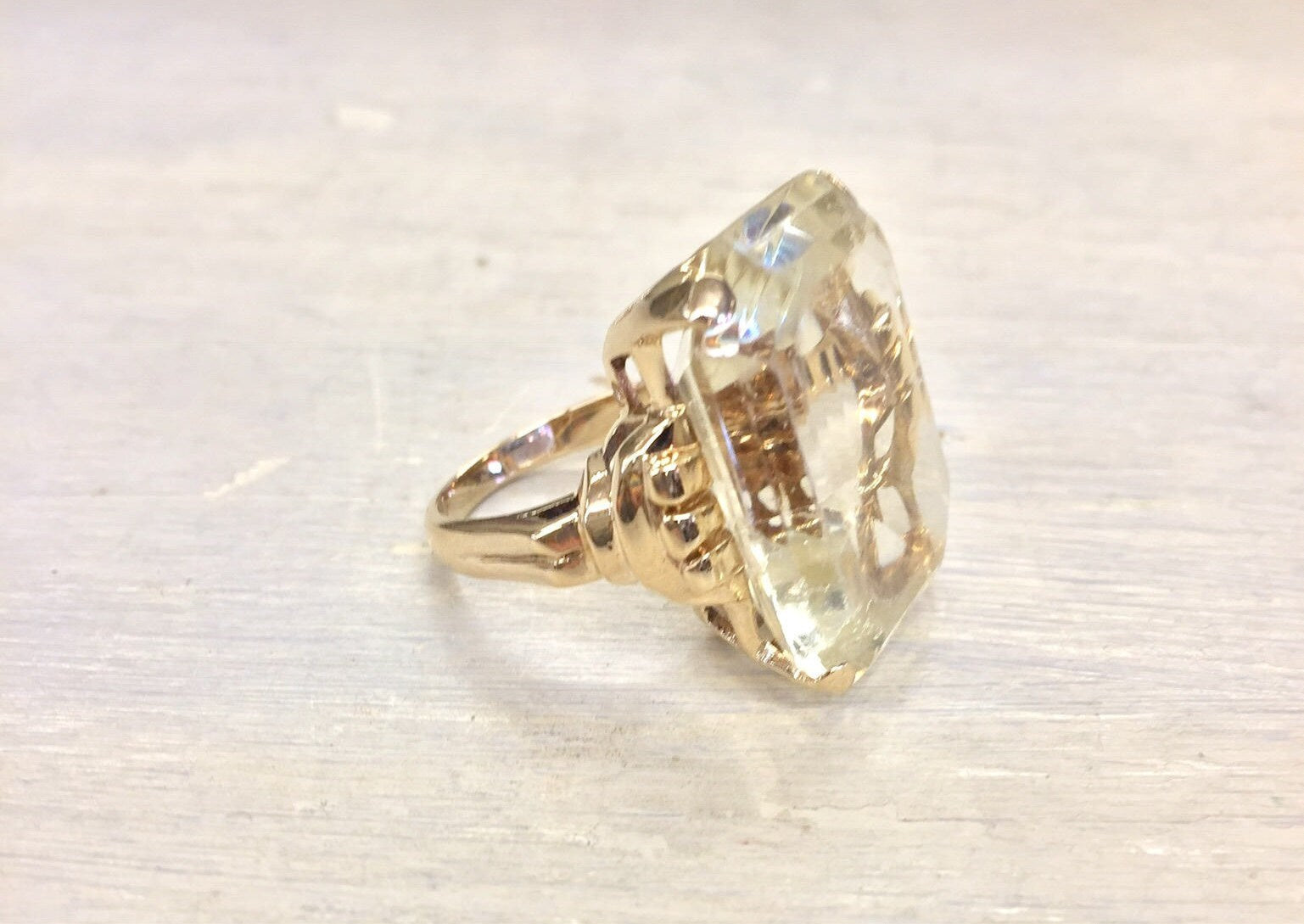 14 karat gold vintage cocktail ring with large faceted gemstone