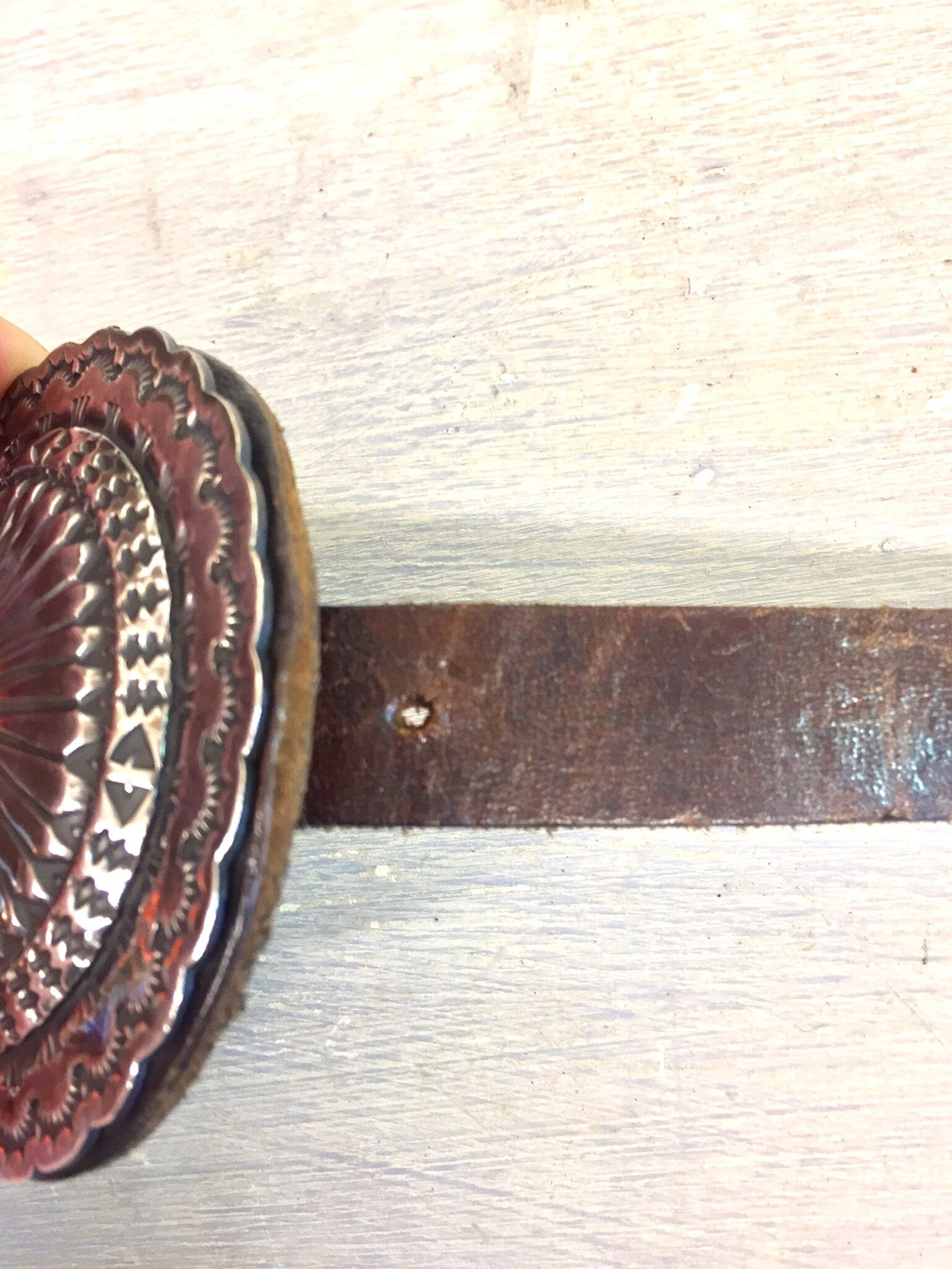 Vintage Navajo sterling silver concho belt with lapis stone inlays on a distressed leather strap, showcasing traditional Native American craftsmanship and southwestern style.
