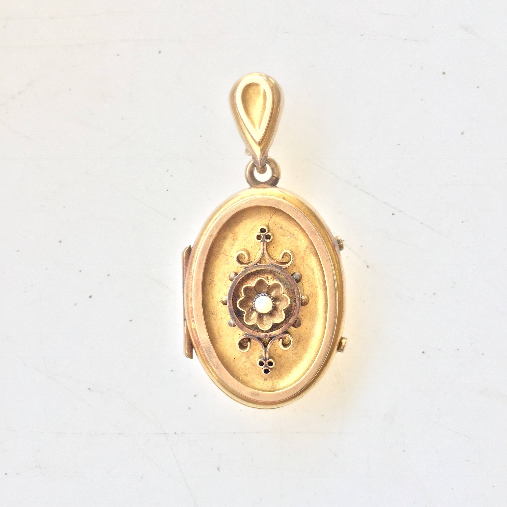 Antique 10 karat gold Victorian locket pendant charm with intricate floral design, perfect keepsake necklace gift for her.