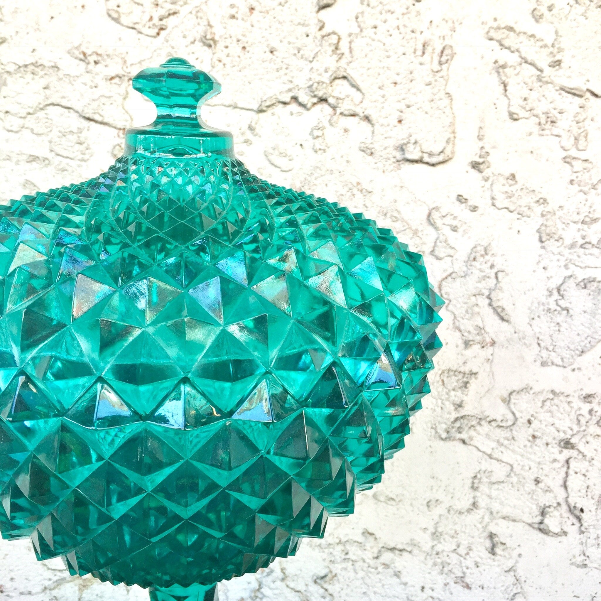 Large aqua green sawtooth pattern lidded pedestal compote bowl made of Depression-era glass, with textured geometric design, suitable for home decor or as a unique gift