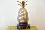 Vintage brass pineapple-shaped table lamp on wooden base, decorative bohemian home decor accent light fixture