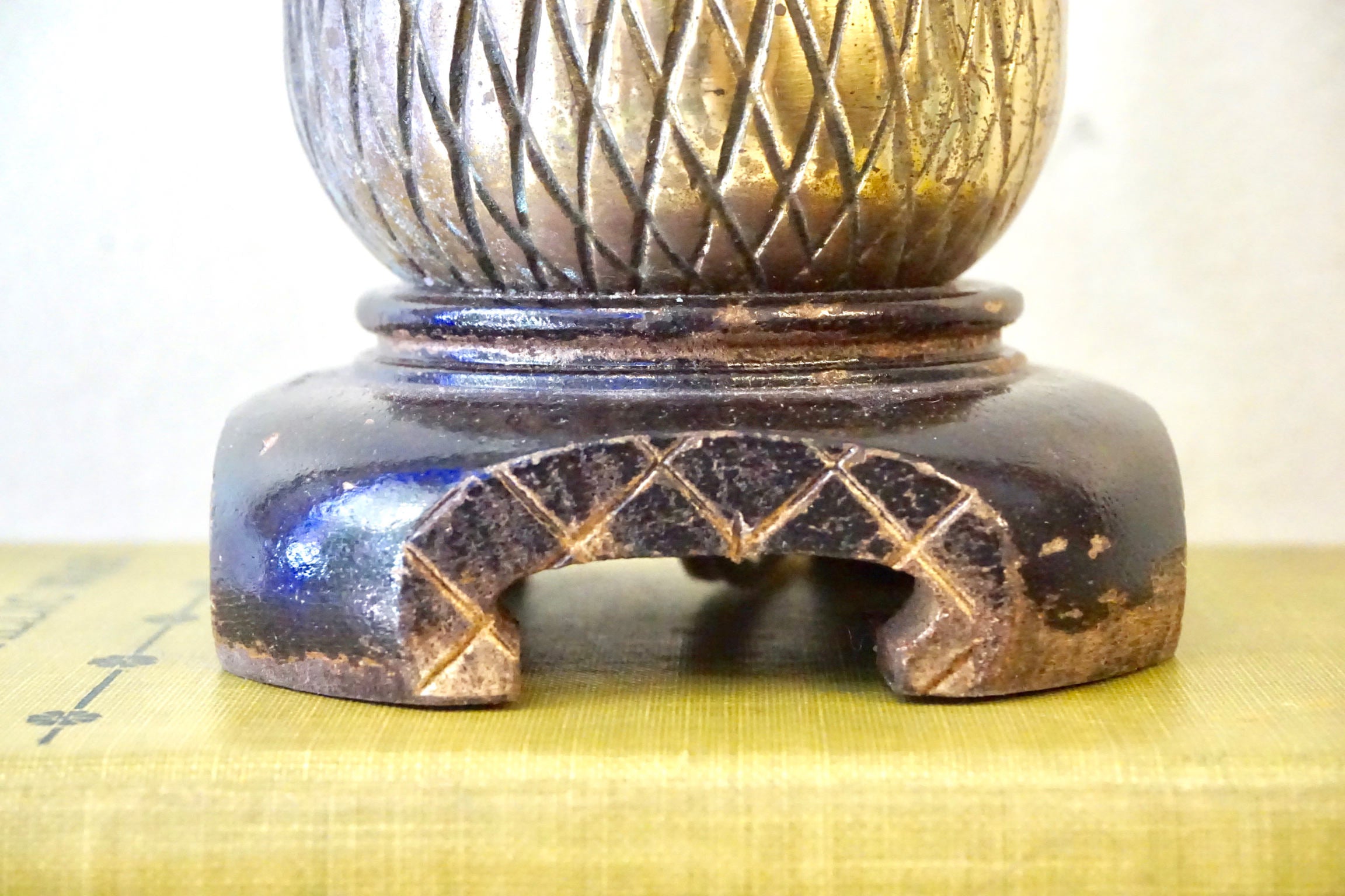 Vintage brass pineapple lamp on yellow textile, decorative small accent light fixture for bohemian home decor