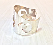 Vintage sterling silver Reed and Barton cuff bracelet with swirl design, perfect gift idea for lovers of vintage silver jewelry.