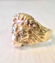 Vintage 10K gold lion head ring with diamond accents, featuring intricate detailing on the lion's mane and a bold, statement-making design from the retro era.