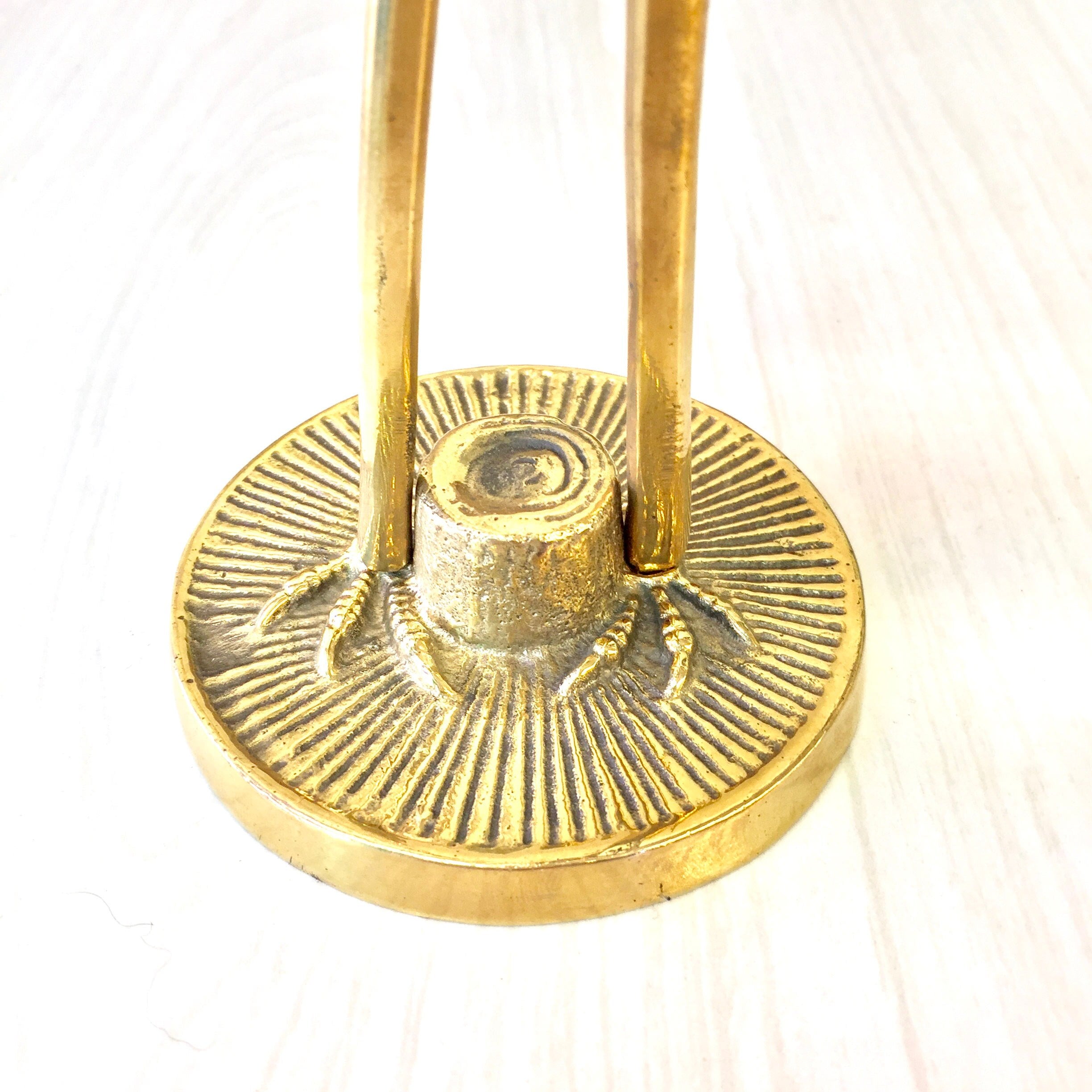 Vintage brass crane figurine sculpture with radial etched design on circular base, midcentury modern style brass bird statue for home decor