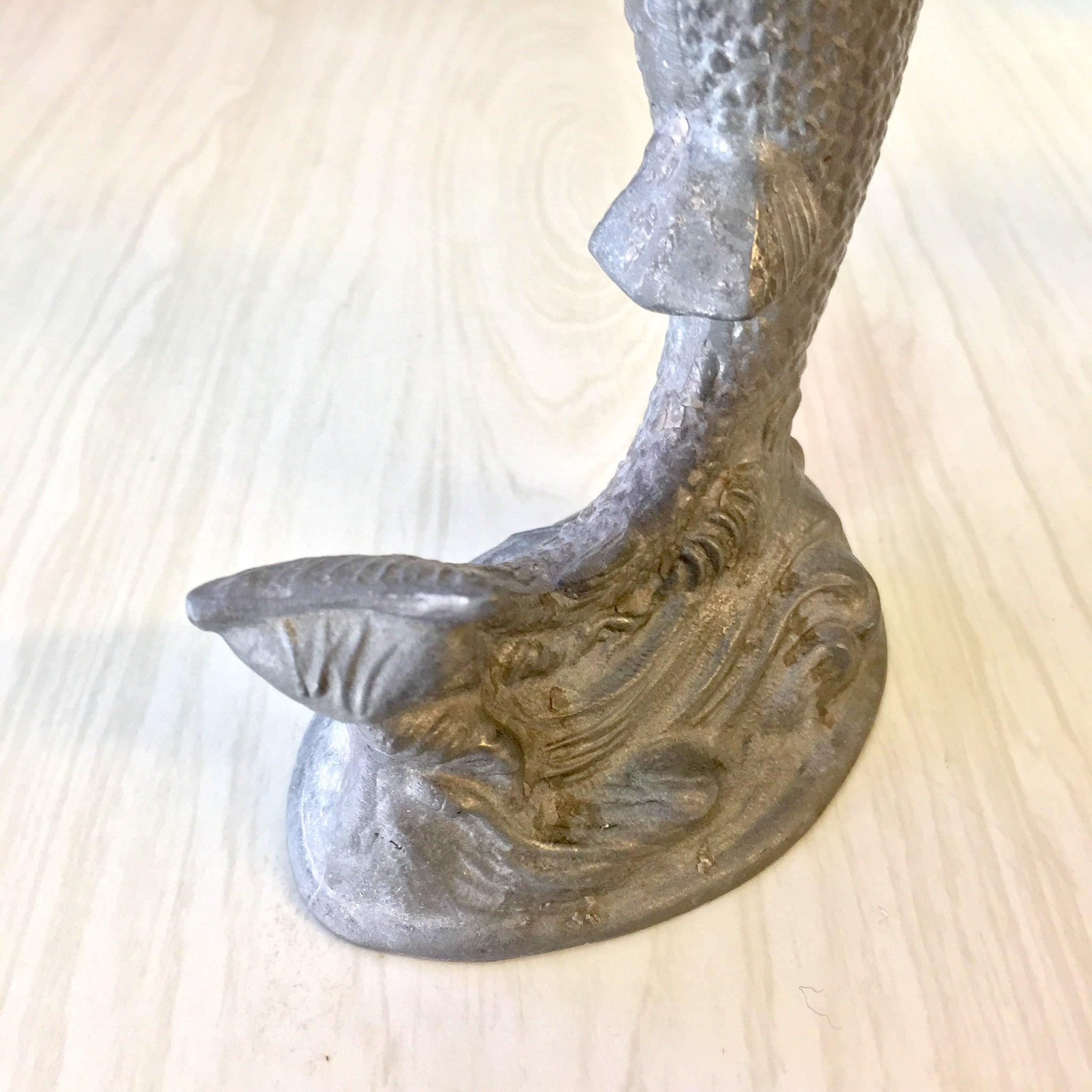 Vintage pewter fish-shaped candlestick holder on wooden surface, antique home decor gift idea for housewarming or holidays