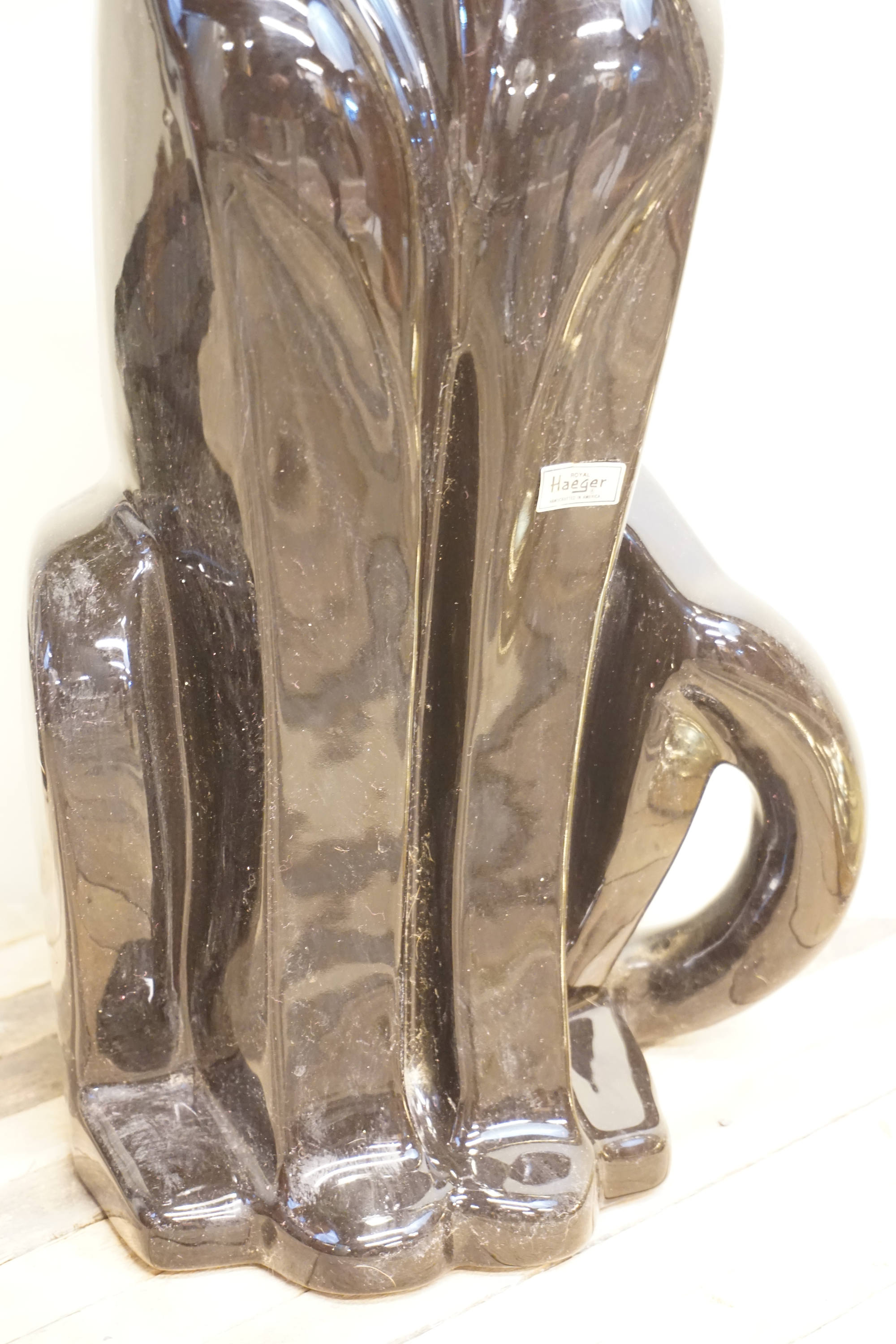 Tall ceramic Royal Haeger panther statue from the 1970s in dark brown glaze, vintage home decor piece.