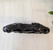 Vintage black ceramic panther figurine, small decorative cat statue made in Japan, suitable for home decor on mantles, bookcases or as a gift for cat lovers.