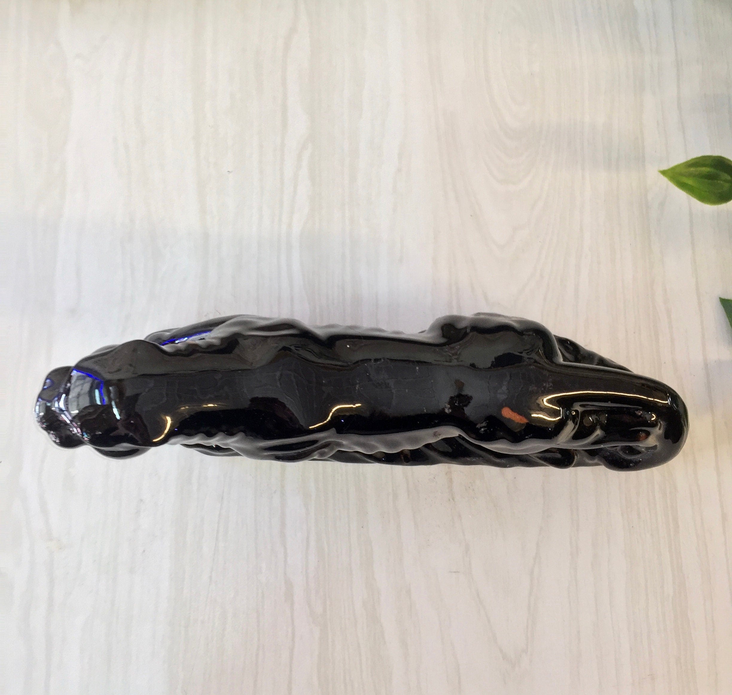 Vintage black ceramic panther figurine, small decorative cat statue made in Japan, suitable for home decor on mantles, bookcases or as a gift for cat lovers.