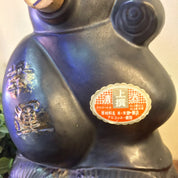Vintage black and gold Asian sake bottle featuring a textured animal design, likely depicting rats, with a unique Japanese label on the front, providing an interesting and rare decor piece.