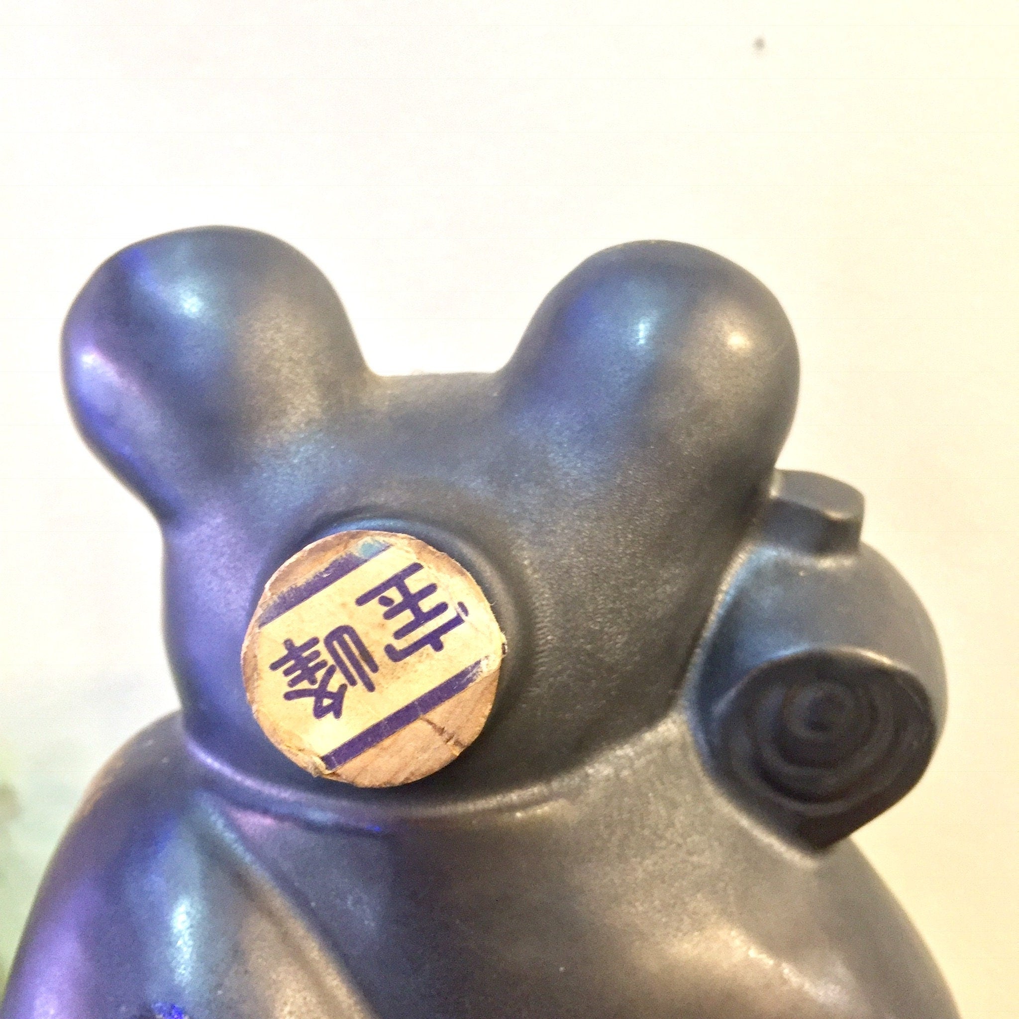 Large vintage blue ceramic sake bottle shaped like a rat, featuring gold Chinese character and detailing, unique Asian home decor piece