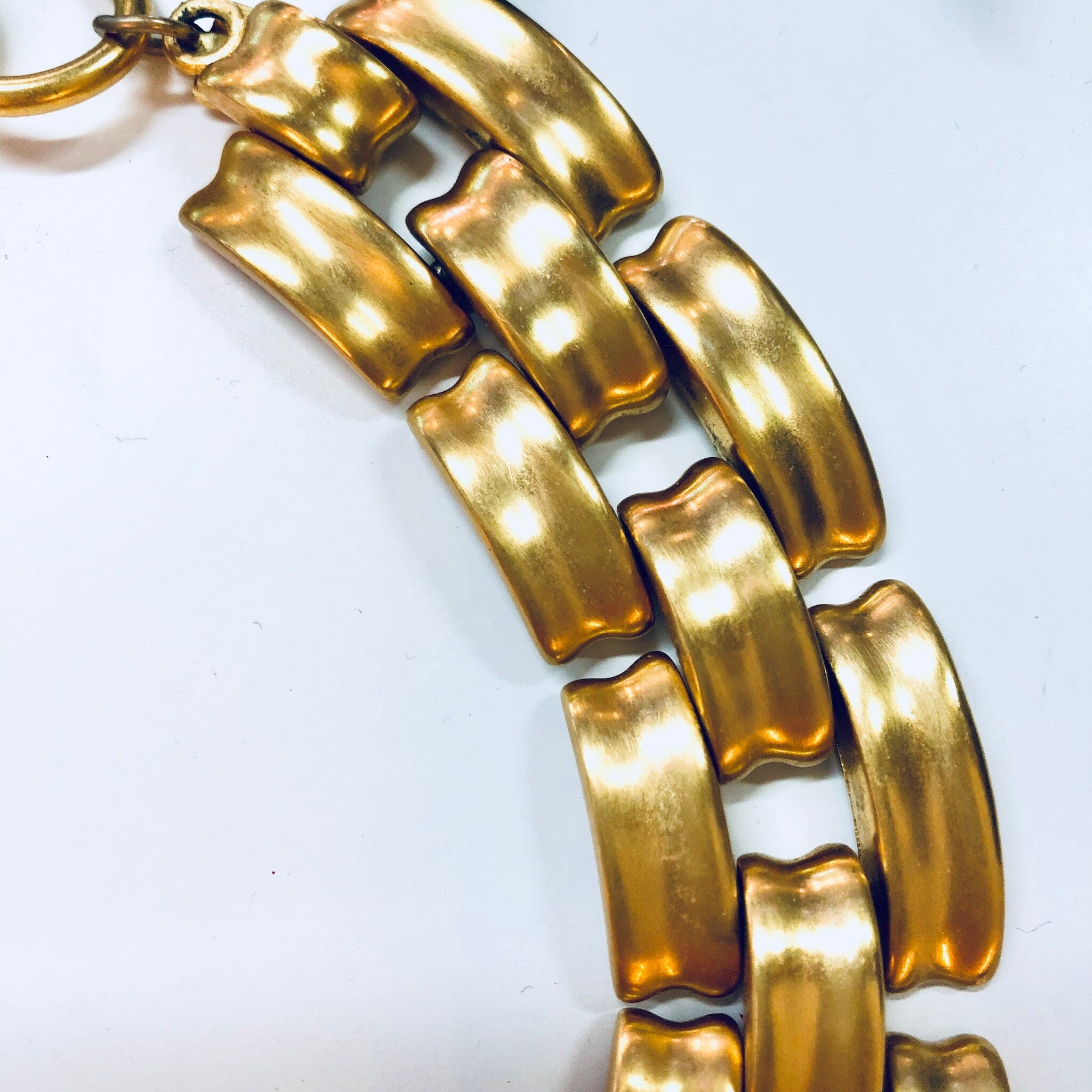 Vintage gold-toned Anne Klein chunky chain link choker necklace with toggle closure, displaying a close-up view of the thick, interlocking curved rectangular links.