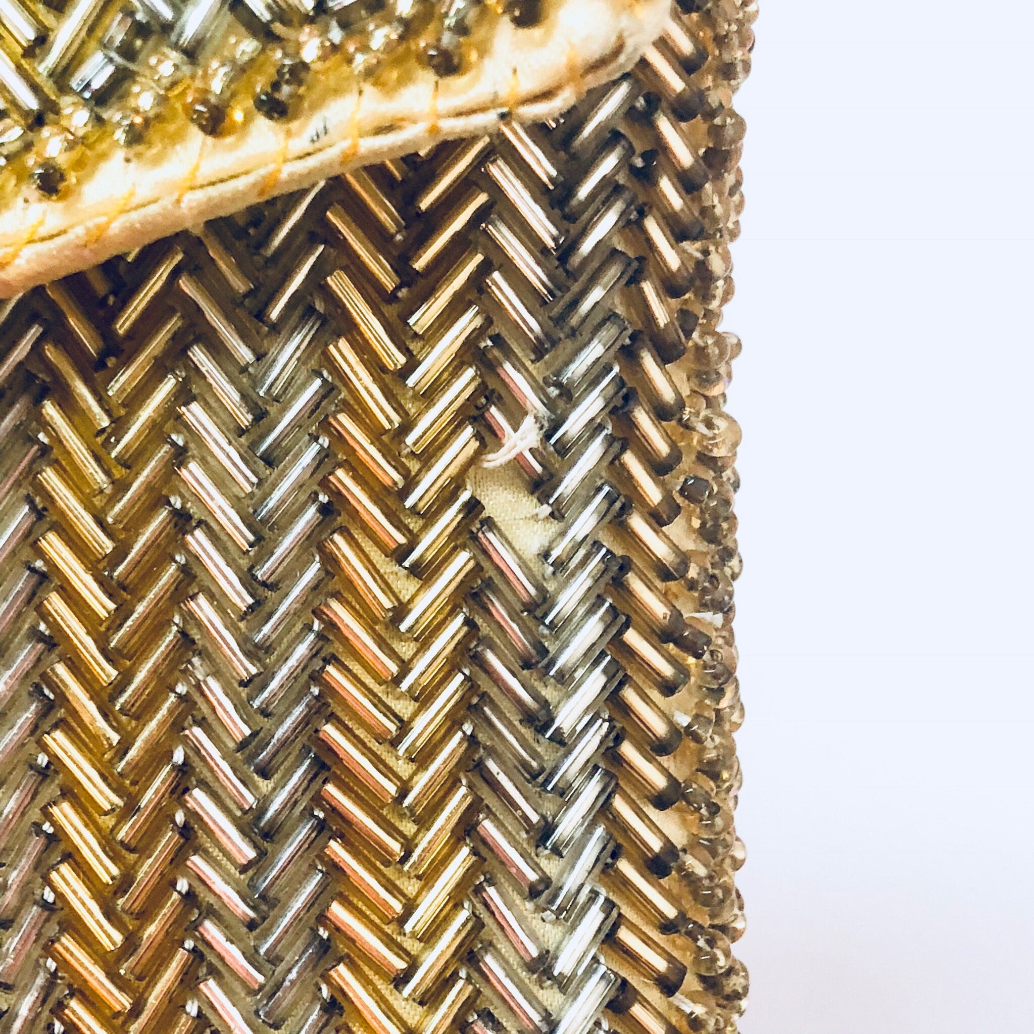 Vintage beaded envelope clutch purse with intricate gold and silver bead pattern, suitable for formalwear, weddings and special occasions.