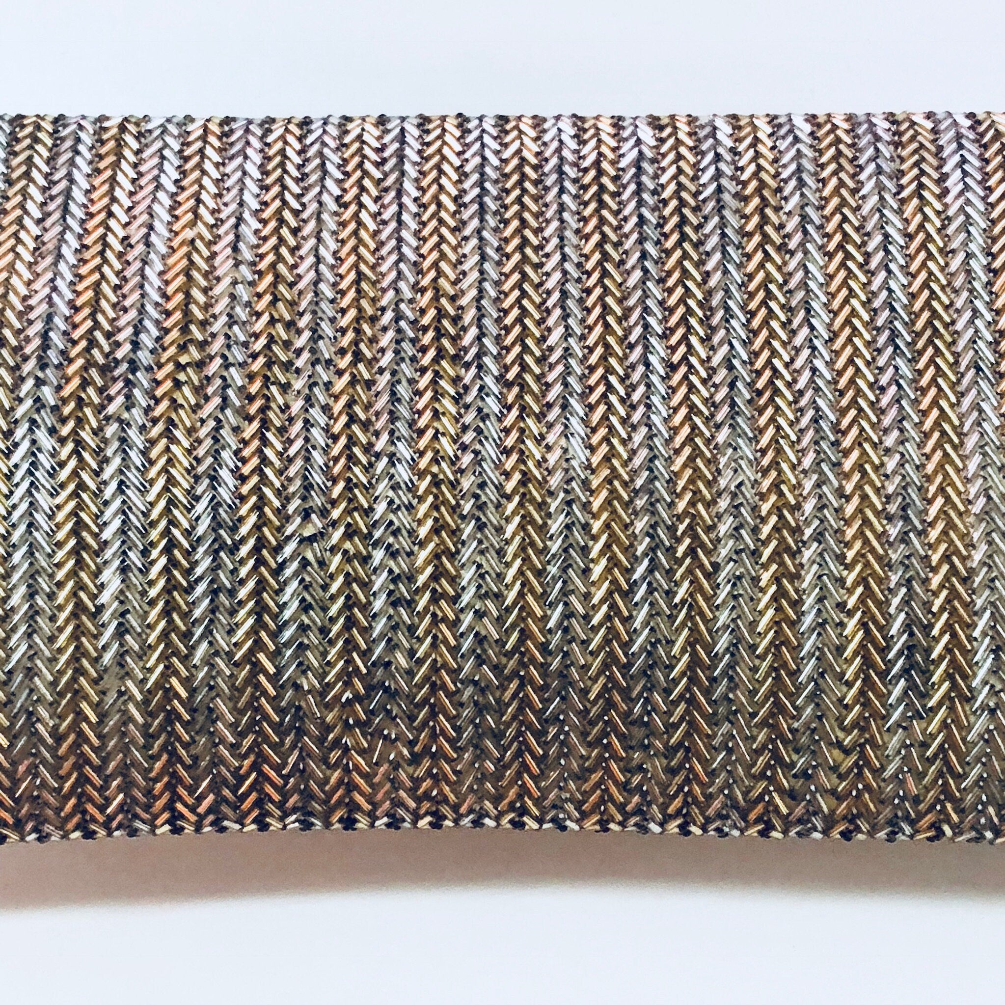 Vintage beaded clutch purse with intricate gold and silver chevron pattern, envelope style, suitable for formalwear, weddings or special occasions.