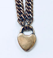 Vintage gold-toned heart locket bracelet with thick chain, costume jewelry