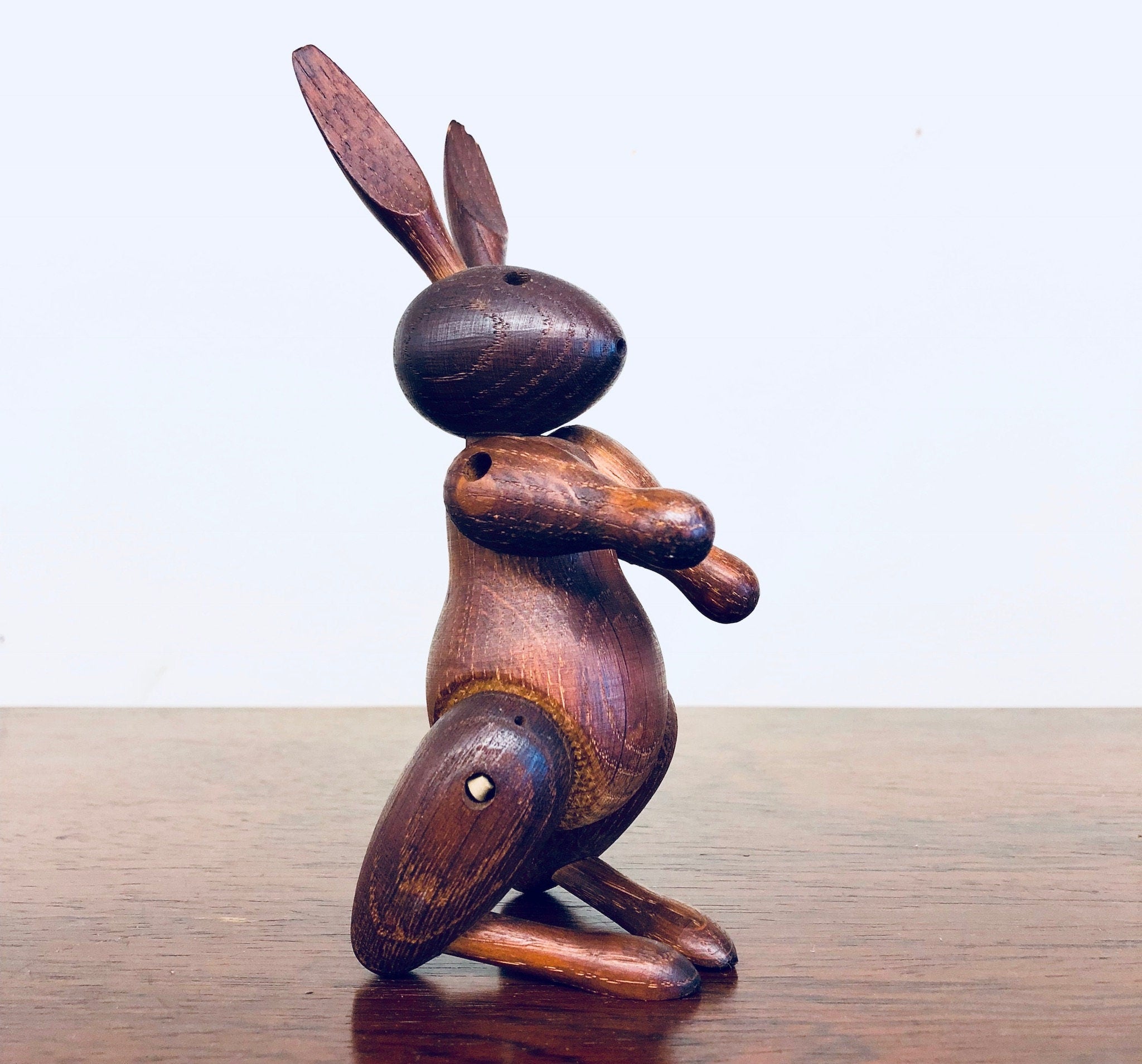 Vintage carved wooden rabbit figurine toy with rustic finish, collectible animal home decor