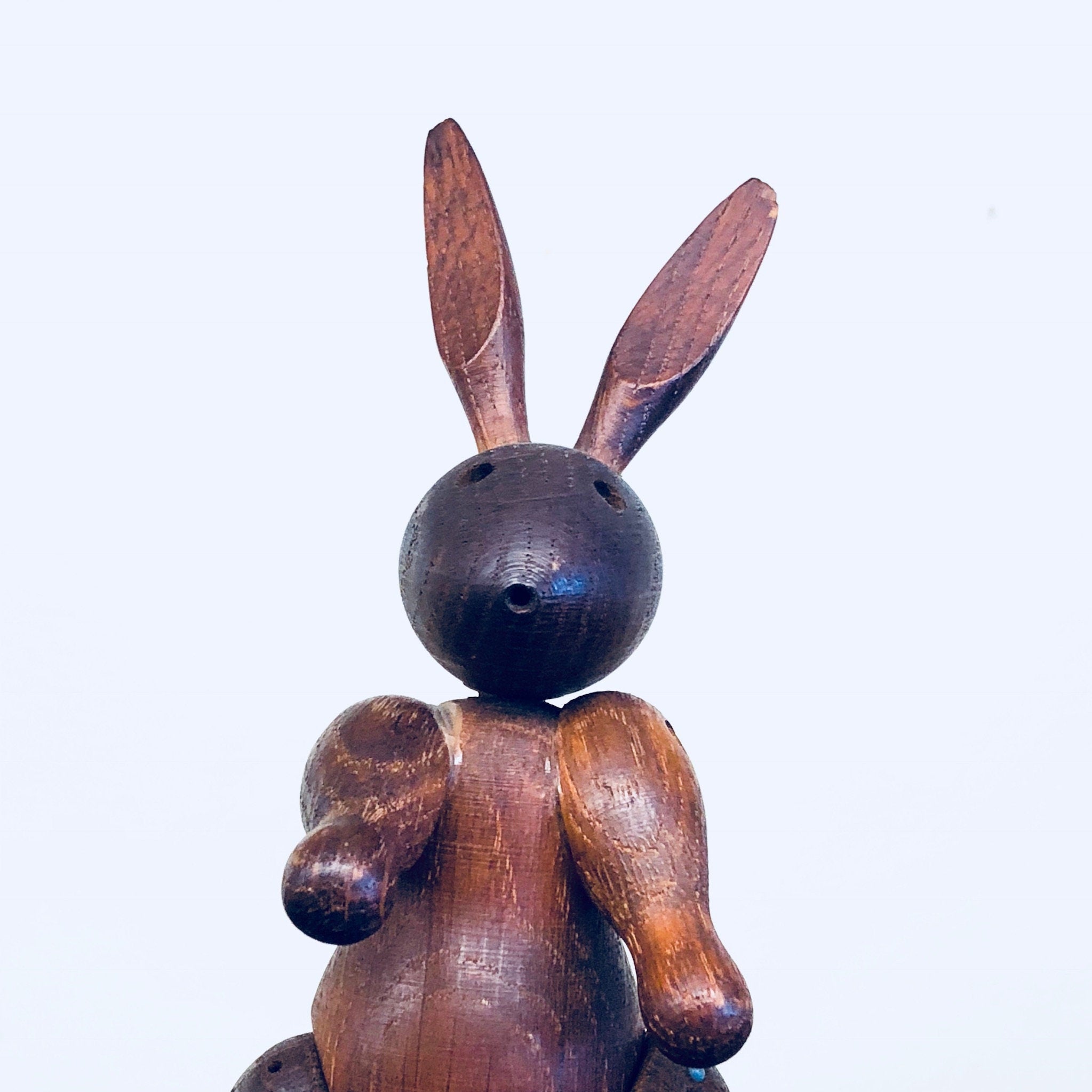 Vintage wooden rabbit toy carving with large ears and round head, collectible animal decor bunny figurine sculpture