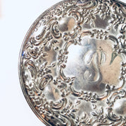 Ornate vintage sterling silver compact mirror with intricate floral embossing and monogram, crafted by Towle Silversmiths, for a elegant handheld mirror.