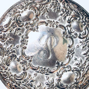 Vintage sterling silver compact mirror with intricate floral embossing and engraved monogram, crafted by Towle Silversmiths, for use as a handheld mirror.