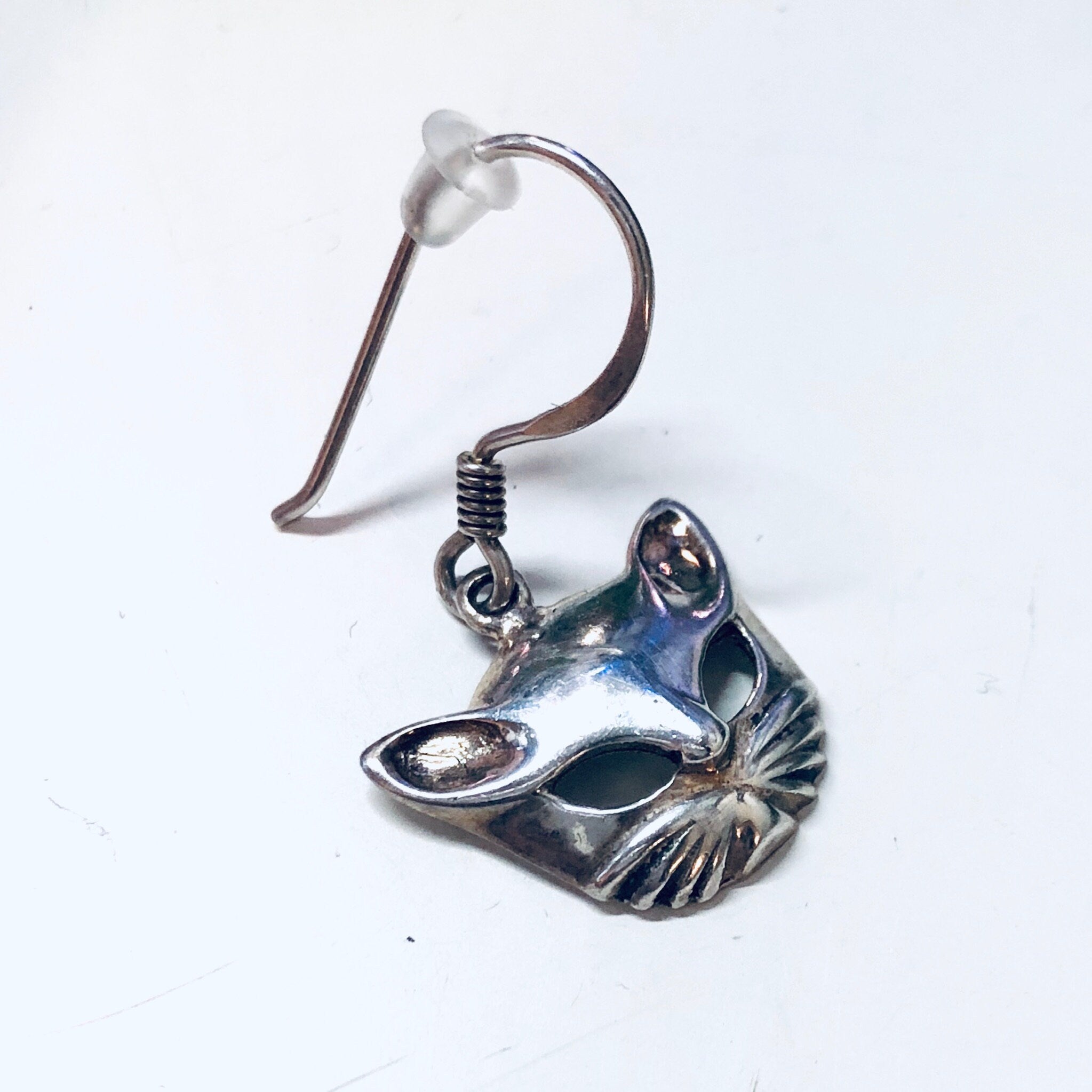 Vintage silver cat mask earrings with cutout design on dangle hooks, cute kitty cat jewelry.