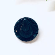Vintage black carved Bakelite mourning brooch from the 1930s, round pin shape with intricate carved details