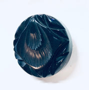 Vintage carved black Bakelite mourning brooch pin from the 1930s with textured swirl design.