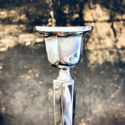 Vintage silver candle holder on textured background