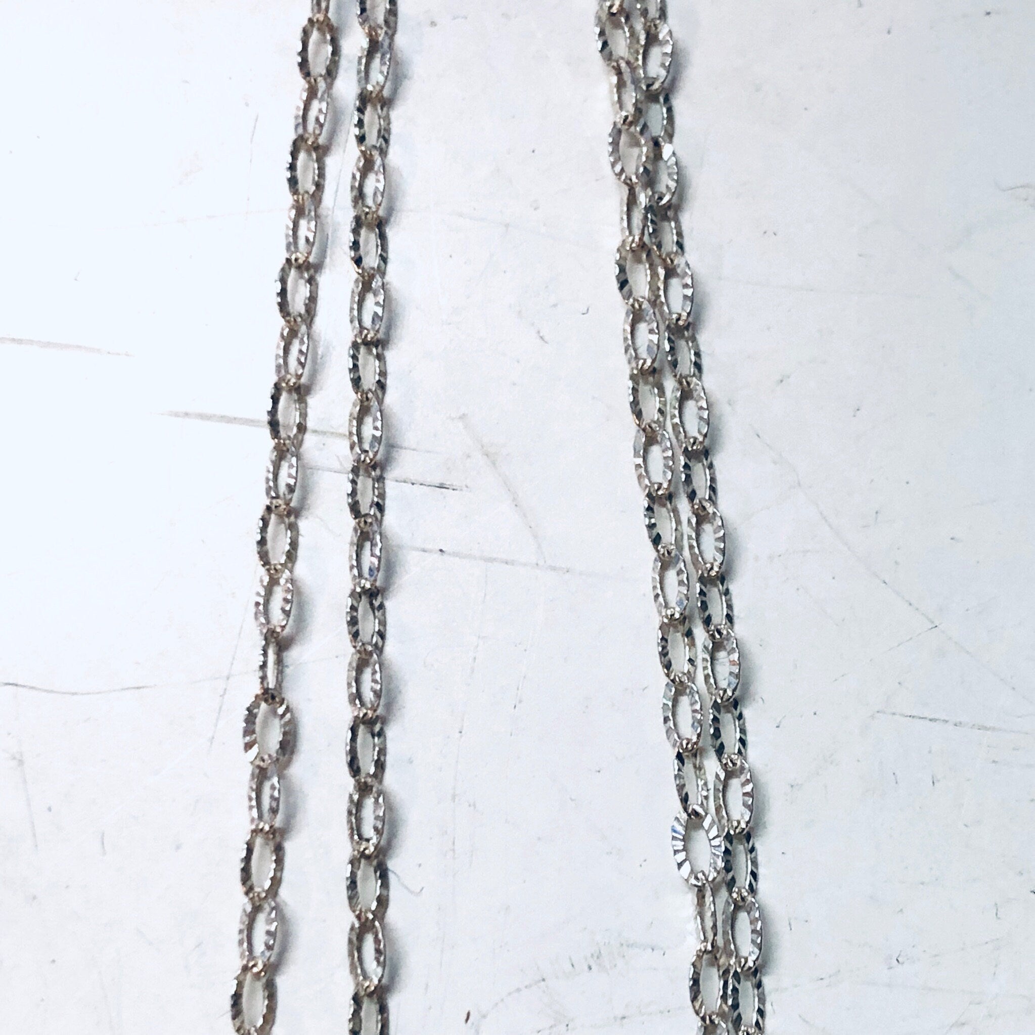 Vintage silver chain necklace with intricate oval-shaped pendants resembling pentagrams or Baphomet symbols, creating a gothic or witchy aesthetic suitable for Valentine's Day or everyday wear.