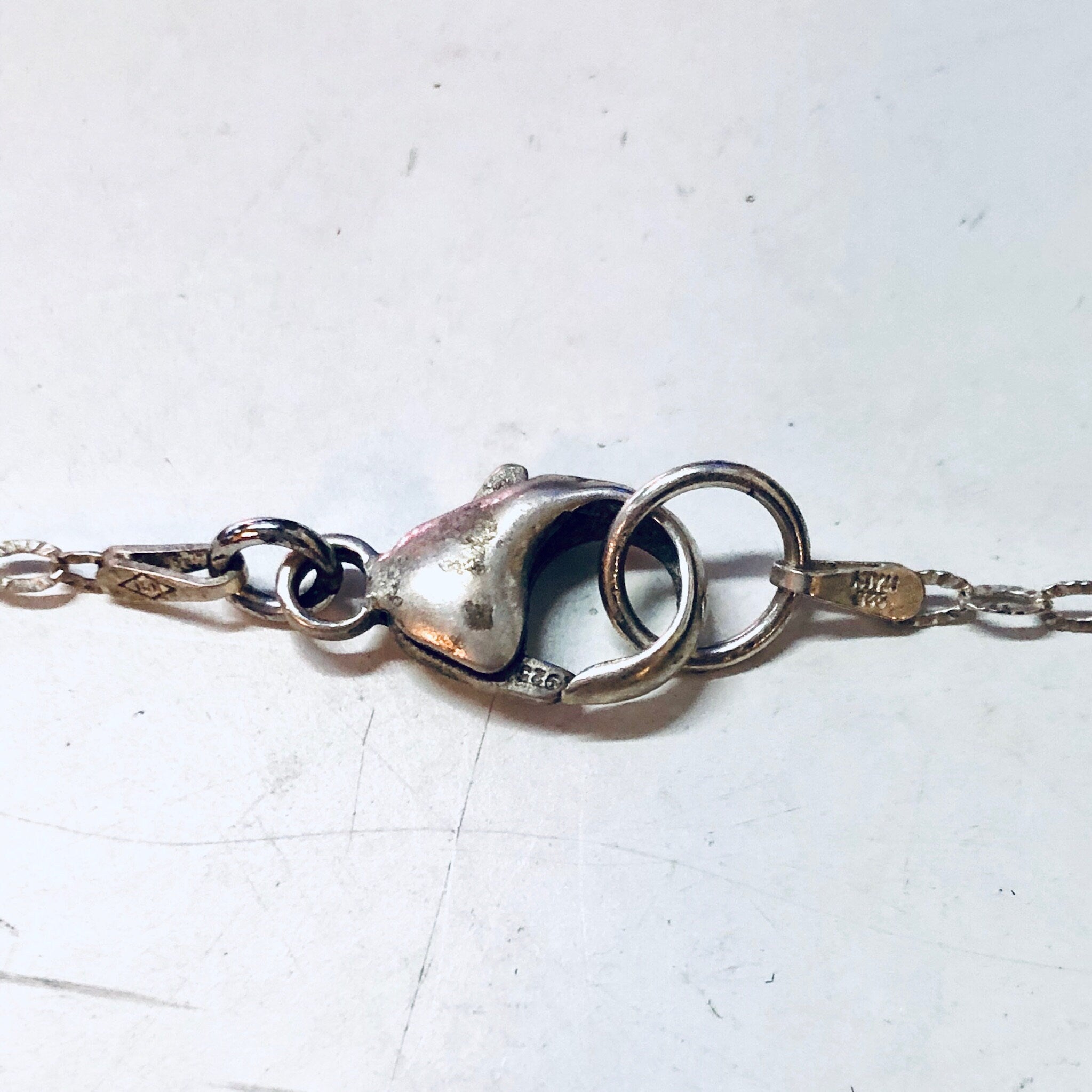 Vintage silver Baphomet pendant necklace with thin chain on white background, gothic witch jewelry perfect for Valentine's Day gift