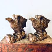 Vintage ceramic eagle bookends with a gold-toned finish, depicting majestic birds soaring. Perfect decor for a bookshelf or library.