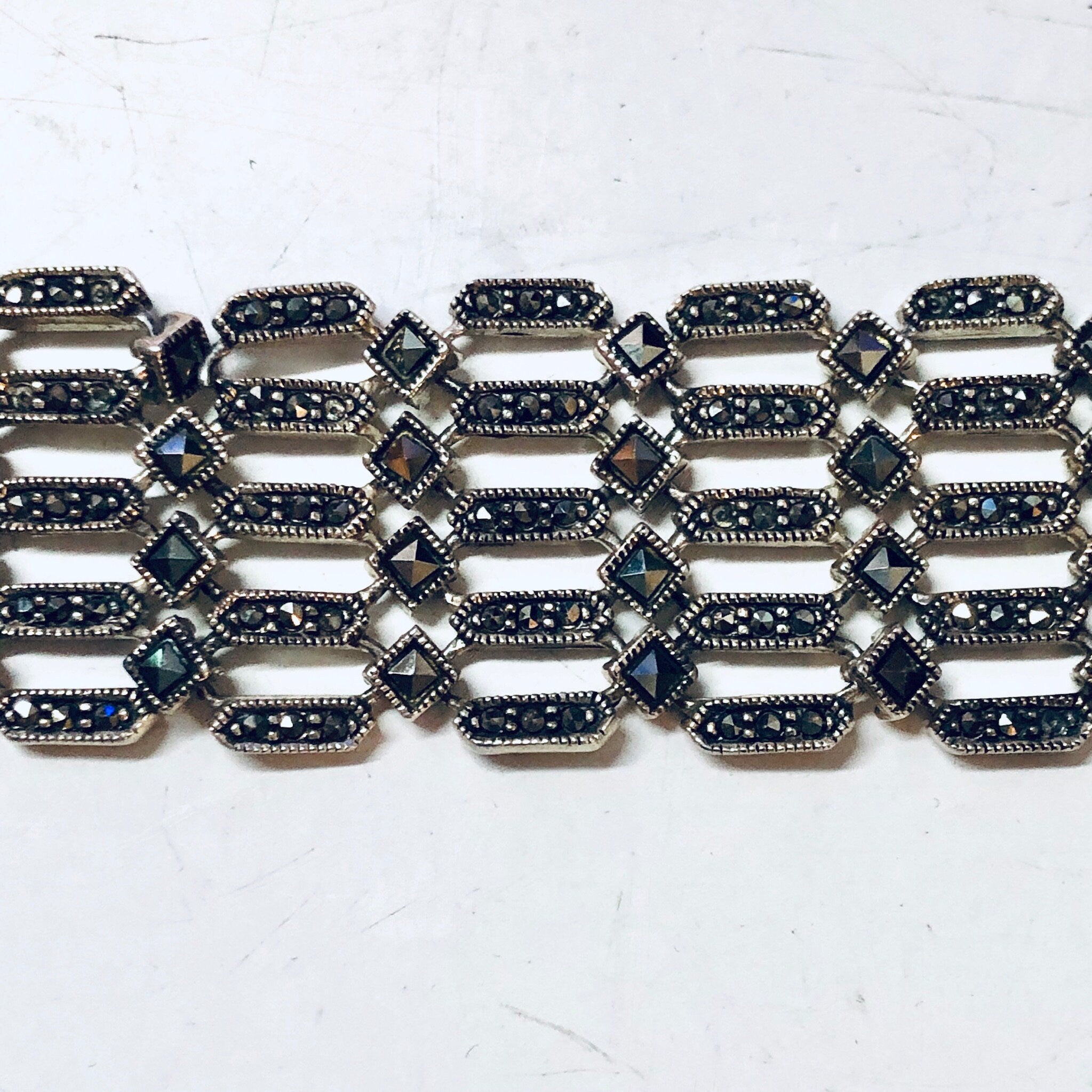 Vintage sterling silver marcasite link bracelet, statement jewelry piece with intricate geometric design featuring alternating silver and marcasite stones, perfect Valentines Day gift idea.