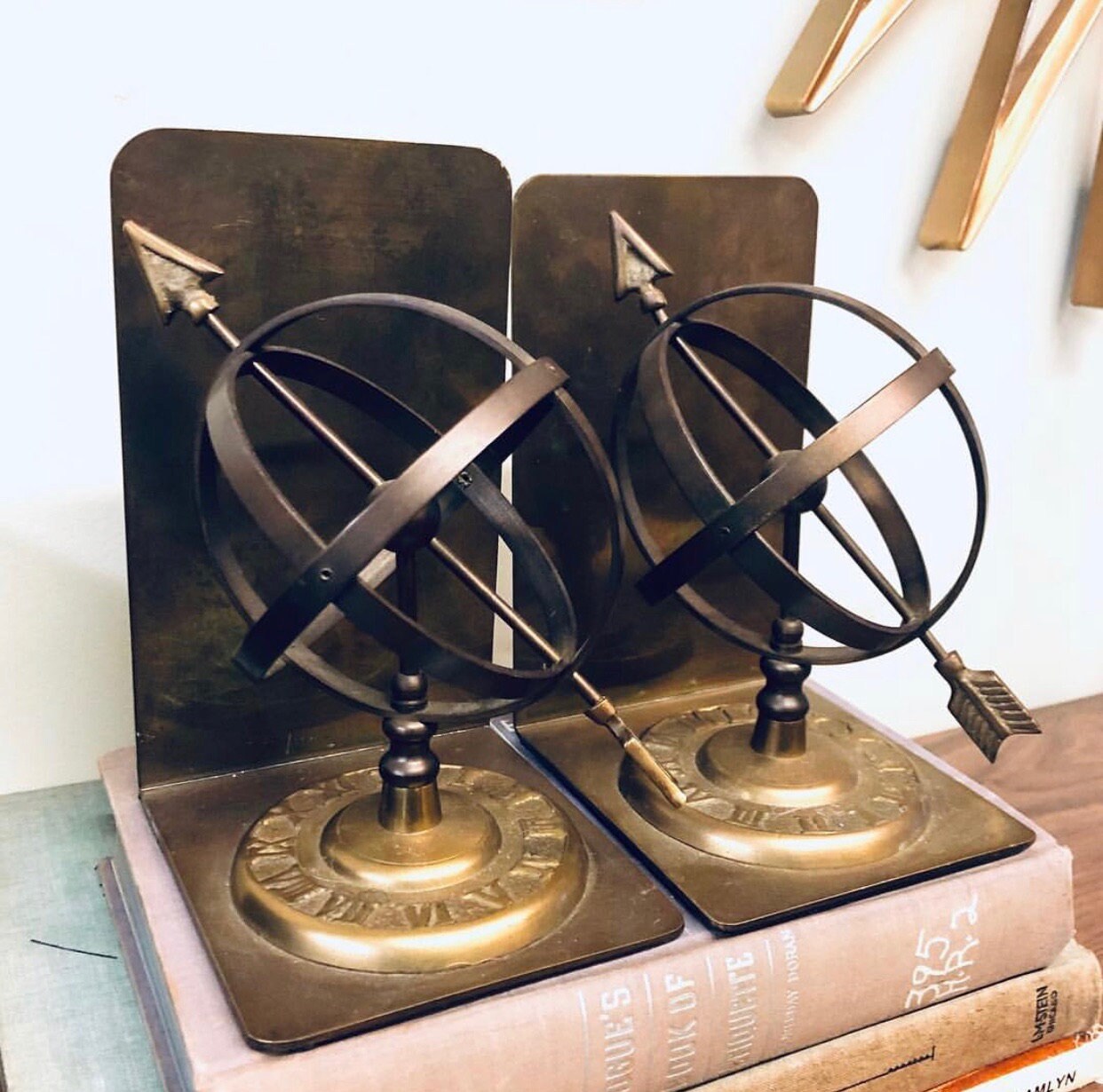 Vintage brass sundial bookends with spherical design and Roman numerals, unique home decor for bookshelves and libraries