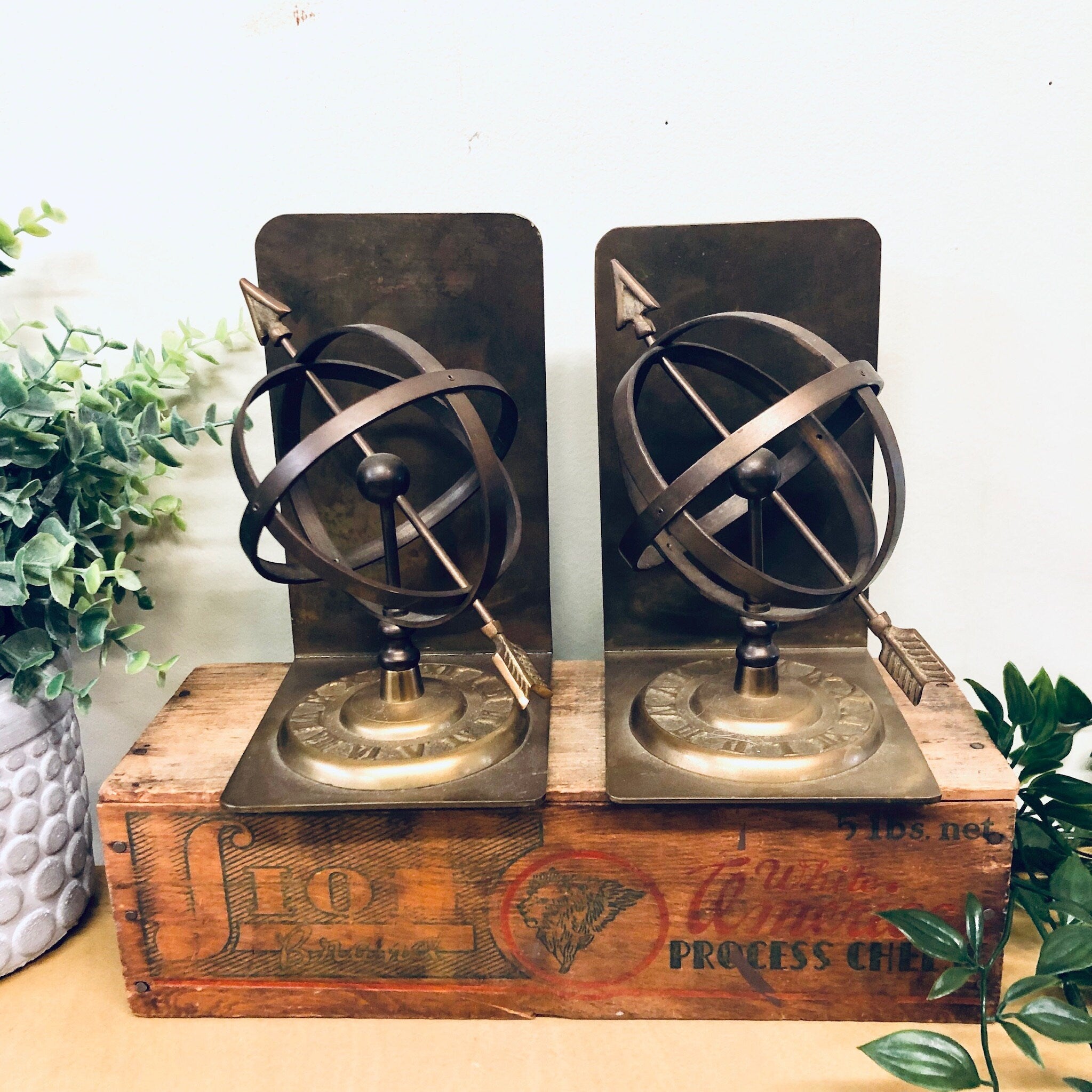 Vintage brass spherical sundial bookends with roman numerals on wooden base, unique home decor for bookshelves or library