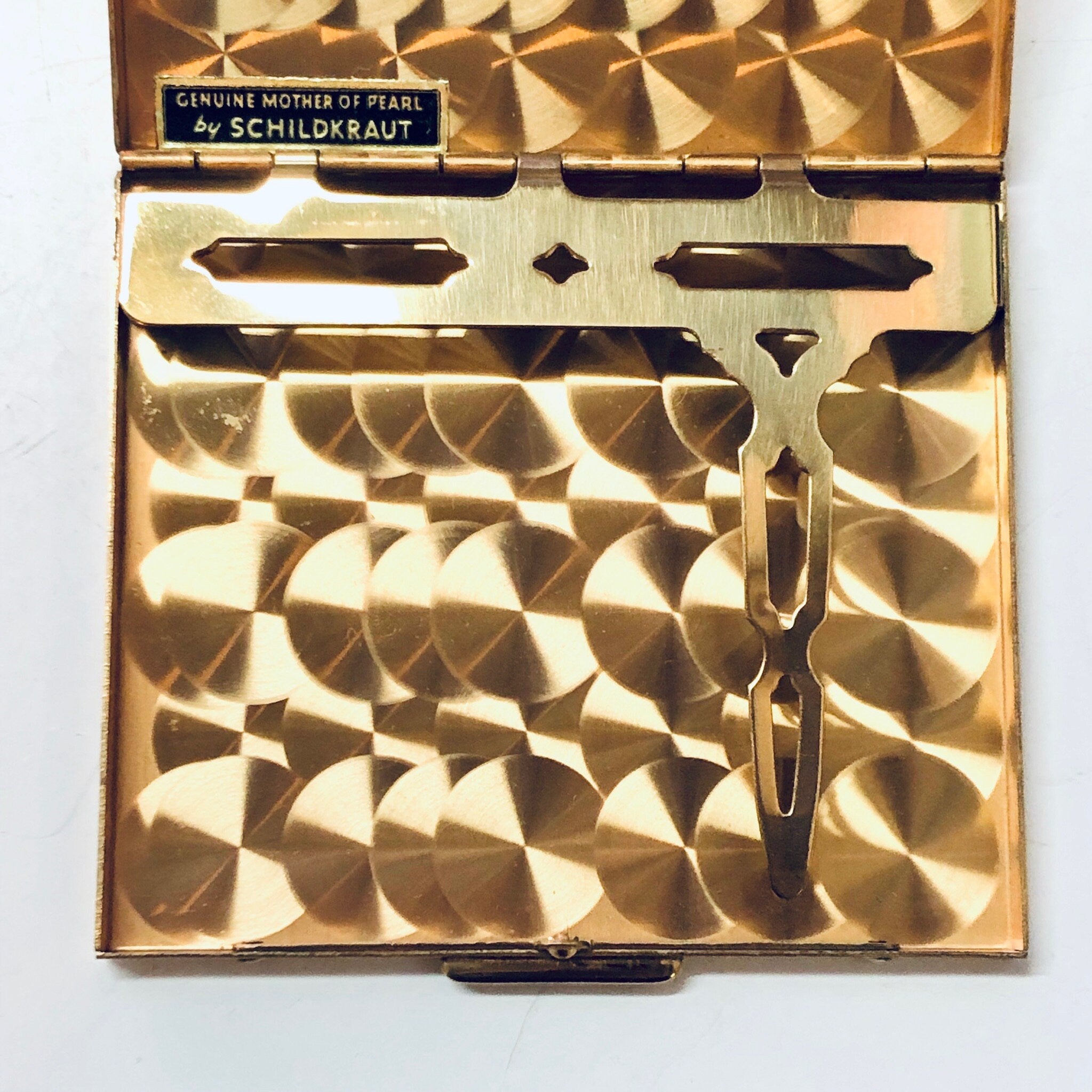 Vintage gold-toned mother of pearl cigarette case and business card holder by Schildkraut, with geometric diamond-shaped inlaid pattern, from Bailey Banks and Biddle.