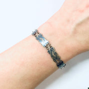 Vintage Siam sterling silver enamel bracelet with blue floral design on wrist, small size 925 silver goddess jewelry.